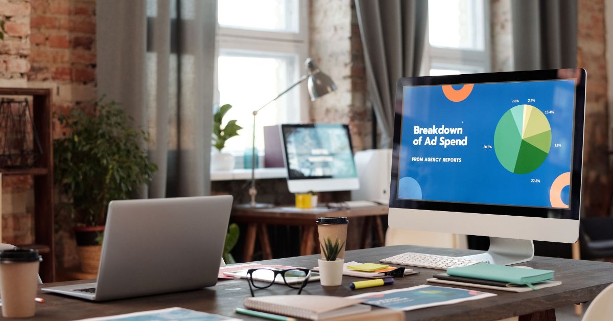 Paid Advertising - A computer with a breakdown of ad spend on it